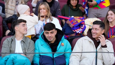 Gabi, Pedri and Robert Lewandowski at Camp Nou on Sunday. EPA