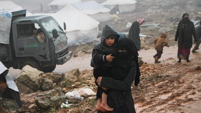 A Syrian woman in the governorate of Idlib. The woman is among thousands of civilians who have fled a Russian-backed offensive by the regime on the rebel town of Maaret Al Numaan in the south of the province December 27, 2019. AFP