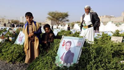 Yemenis visit the graves of relatives in the capital Sanaa on the first day of Eid Al Fitr.