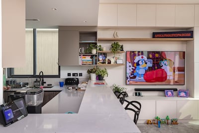 The family are loving life in their off-plan home. Antonie Robertson / The National