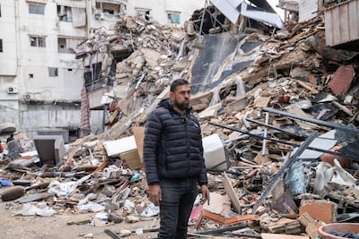 Hassan Nabulsi stands in front of the building in Dahieh that was once his home. Matt Kynaston for The National