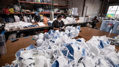Employees of Suay Sew Shop make face masks amid the coronavirus pandemic in Los Angeles, California, USA. EPA