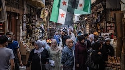 People shop at a market in Damascus. Syria is relatively thriving under President Ahmad Al Shara, while Lebanon remains mired in problems. Getty Images