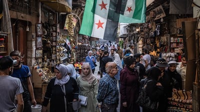 People shop at a market in Damascus. Syria is relatively thriving under President Ahmad Al Shara, while Lebanon remains mired in problems. Getty Images