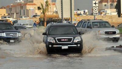 A flooded street in the north of the Saudi capital, Riyadh. Sixteen people have died and three more are missing in Saudi Arabia after downpours caused flash floods in several areas of the kingdom.