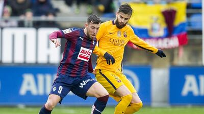 Gerard Pique, right, in action against Eibar on Sunday night. Juan Manuel Serrano Arce / Getty Images