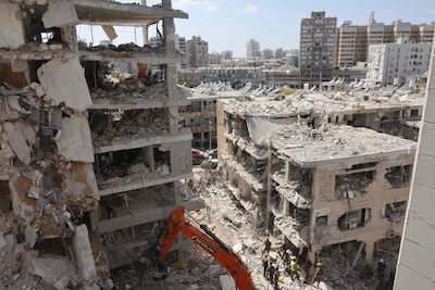Israeli rescuers search through rubble in Bat Yam after a retaliatory strike by Iran. AFP