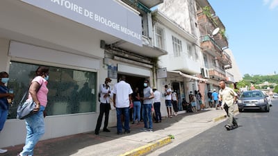 Residents queue for a Covid-19 test at a laboratory in Fort-de-France, in the French Caribbean island of Martinique. AFP