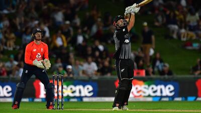 New Zealand's Daryl Mitchell wacthes his shot land in the hands of England fielder Tom Banton as he is out for 14. AFP