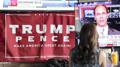 People watch as the results come in at Trump International Golf Club.