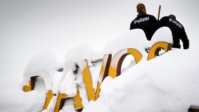Swiss police stand on the roof of the Kongress hotel next to the Congress Center ahead of the 48th annual meeting of the World Economic Forum, WEF, in Davos, Switzerland, Laurent Gillieron / Keystone / AP