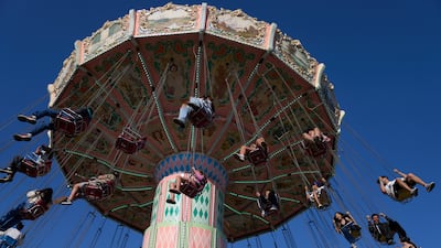 People ride the swing ride at the Ventura County Fair in Ventura, California, US. EPA