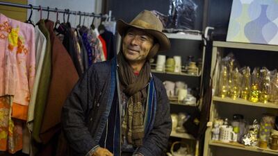 Yoshiyuki Matsuura, a regular customer, visits a friend’s indoor secondhand clothes store at Boroichi flea market in Tokyo. Thomas Peter / Reuters