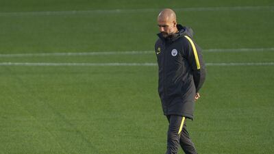 Manchester City manager Pep Guardiola, centre, leads the training session. Peter Powell / EPA