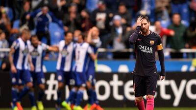 Lionel Messi reacts during as Deportivo players celebrate in the background. Barcelona lost 2-1 in their Primera Liga tie with Deportivo at Riazor Stadium on March 12, 2017 in La Coruna, Spain. Octavio Passos / Getty Images