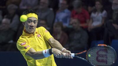 Japan's Kei Nishikori eyes the ball as he returns to Serbia's Dusan Lajovic during their first round match at the Swiss Indoors tennis tournament at the St. Jakobshalle in Basel, Switzerland, on Monday, Oct. 24, 2016. Georgios Kefalas / AP