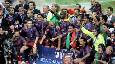 Barcelona celebrate with the Champions League trophy. Getty