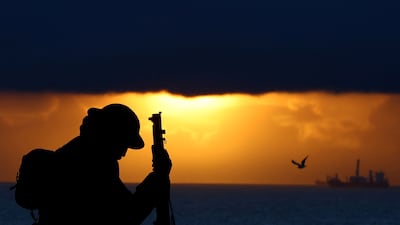 'Tommy', a war statue by artist Ray Lonsdale, is seen during sunrise ahead of Remembrance Day in Seaham. Reuters
