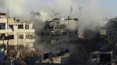 Smoke rises from damaged buildings during what activists said were clashes between Free Syrian Army fighters and the forces of Syria's President Bashar Al Assad in Jobar, a suburb of Damascus on January 4, 2015. Msallam Abd Albaset /Reuters