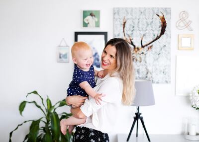Mette Jensen works from home, giving her more time with her daughter, Sienna. Reem Mohammed / The National