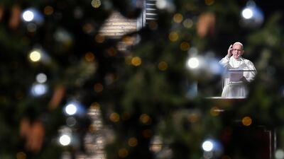 Pope Francis addresses the crowd from the window of the apostolic palace overlooking Saint Peter's square at The Vatican. AFP