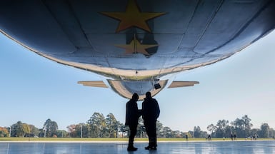 A silver Aerolineas Argentinas plane enters a hangar at Ezeiza International Airport in Jose Maria Ezeiza, Argentina, on May 22, 2026. The state-owned airline introduced the plane that will take the Argentina national football team to the 2026 World Cup in North America, featuring a design that incorporates the No 10 jersey of the team's captain and star player, Lionel Messi. EPA