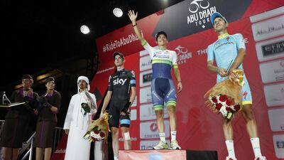 Esteban Chaves, centre of podium, became the first winner of the Abu Dhabi Tour. Elia Viviani, in black, won Stage 4. Antonie Robertson / The National