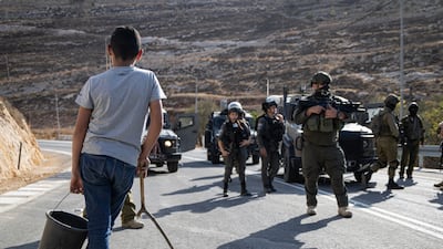 Israel’s occupation of the West Bank has hurt the Palestinian economy, with farmers often prevented from reaching their land. Getty Images