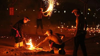 Performers reload molten iron before a performance of Queshan Tiehua in Dongguan, Guangdong Province of China. “Queshan Tiehua” was been listed as a protected item of Intangible Cultural Heritage in 2008. VCG / Getty Images