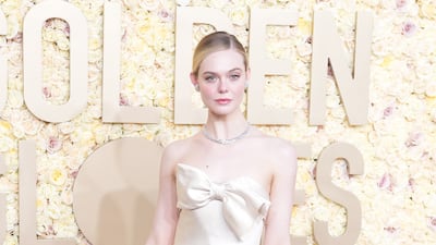 Elle Fanning in ivory vintage Pierre Balmain. EPA