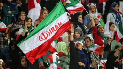 Iranian women cheer ahead of the World Cup qualification football match between Iran and Cambodia at the Azadi stadium in the capital Tehran . AFP