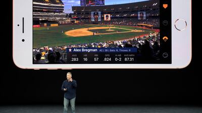 Phil Schiller, Apple's senior vice president of worldwide marketing, shows features of the new iPhone 8 at the Steve Jobs Theater on the new Apple campus in Cupertino, California. Marcio Jose Sanchez / AP Photo