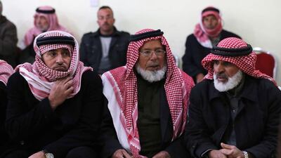 Friends and relatives of Maaz Al Kassasbeh, a Jordanian pilot captured by ISIL, gather in southern Jordan. Photo: Raad Adayleh / AP