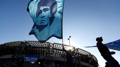 A person waves a Diego Maradona flag outside the Stadio San Paolo in Naples. Reuters