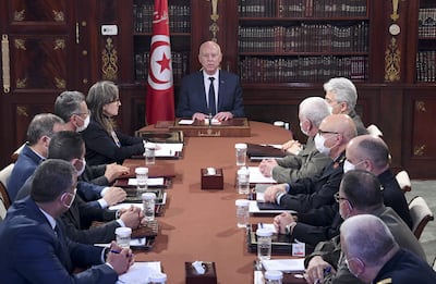 Tunisia's President Kais Saied chairs a National Security Council meeting on March 30. He dissolved parliament and said MPs would be prosecuted. AFP