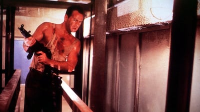 Bruce Willis with a gun in a sequence of 'Die Hard'. Photo: Newscom