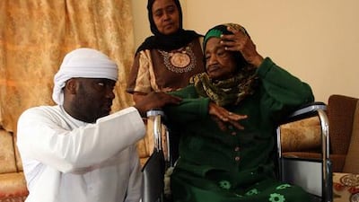 Salma al Sharhan, pictured here with her nephew, Salem Esmaeel, and her carer, Violet Tisera, contributes most of the money she receives from the Government to the poor and the hospital where she worked.