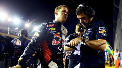 Sebastian Vettel's second-place finish at Singapore is the highlight of a miserable season so far for the four-time Formula One champion, left, that has often seen his teammate, Daniel Ricciardo, have more pace. Lars Baron / Getty Images
