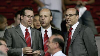 Joel Glazer, Avram Glazer and Bryan Glazer at Old Trafford to watch a match in August 2005