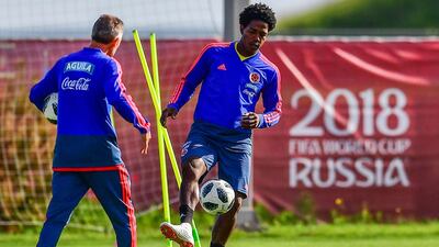 Colombia's midfielder Carlos Sanchez, right, received death threats after the Japan game. AFP