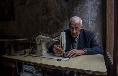 Lebanese photographer Zeinab Khalifeh won the adult's category with this picture of a tailor in Saida. Courtesy National Geographic Abu Dhabi