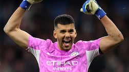 Manchester City goalkeeper Geronimo Rulli celebrates saving Lewis Dunk's penalty in the shootout. Getty Images
