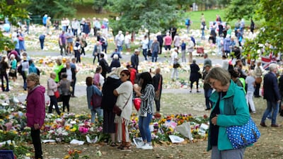 People view floral tributes at Green Park, following the death of Britain's Queen Elizabeth, near Buckingham Palace in London. Reuters