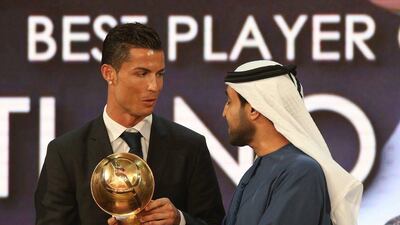 Real Madrid's Cristiano Ronaldo receives the Globe Soccer Award for best player of 2014 during the Globe Soccer Awards in Dubai on Monday night. Ali Haider / EPA