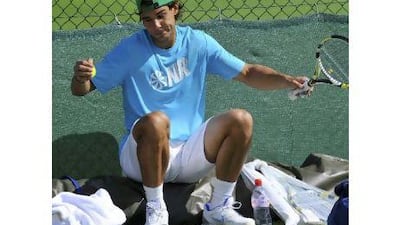 Rafael Nadal was out in the sunshine yesterday, but it may be a different story today. Toby Melville / Reuters