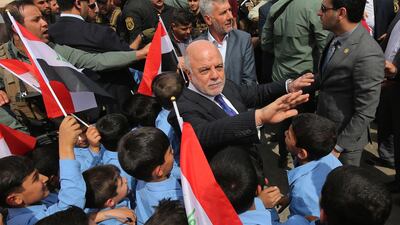 Iraqi Prime Minister Haider al-Abadi arrives for the inauguration of the "Old Bridge", that ran across the centre of Mosul since it was built in 1934, following its reconstruction in the city of Mosul on March 14, 2018, after being blown up by ISIL. Ahmad Al Rubaye / AFP Photo