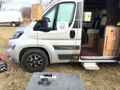 Jan's van offers a place for refugees to charge their phone. Jamie Prentis / The National