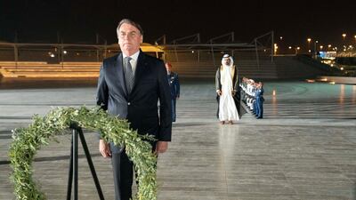 Brazilian President Jair Bolsonaro visits the Wahat Al Karama Martyrs' Monument in Abu Dhabi on Sunday. Wam