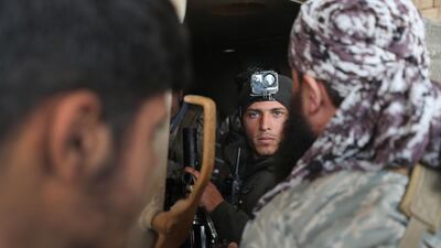 Syrian National Army members in an armoured personnel carrier in the town of Sarmin in Idlib on February 24, 2020. AFP
