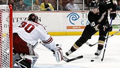 The Ducks' Corey Perry skates in on the Phoenix netminder Ilya Bryzgalov.
